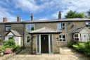 This four-bedroom stone cottage set in an 'amazing' setting with 'fabulous views' over Rivington Pike and North Wales