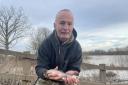 STOCKS: Mark Rogers of Pixham Fishing Syndicate returns tagged barbel to the River Severn near Callow End