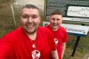 Chris Cowdrey and his son Devlin at the end of their 20-mile charity walk