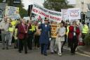 Pic Hattie Miles - Pensioners protest outside the Bournemouth BIC during the Tory Party Conference - Pensioners make their way to the BIC lead by Ron Hands, former doorman at the Royal Bath Hotel