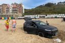 A Jeep stuck in the sand of Boscombe beach