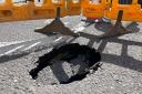 LIVE: Road closed after sinkhole forms