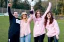 Chelsey, second from right, lifts the trophy