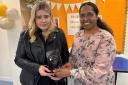 Abbie received the trophy from NHS Lanarkshire’s director of public health, Professor S Josephine Pravinkumar