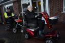 Taunton police officer rides mobility scooter through town