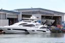 Pic - Corin Messer - 03/06/14 - cm030614pSunseeker2 .Workers with yachts at the Sunseeker boat yard on Poole Quay. .COPYRIGHT - BOURNEMOUTH DAILY ECHO.. (24767513)