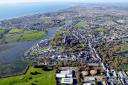 Christchurch from the air, with Bournemouth and Poole in the distance. Picture, Stephen Bath