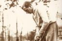 Sir Thomas Henry Cotton, English professional golfer who won three Open Championships, seen here on a golf course checking his clubs and putters, circa 1930s.