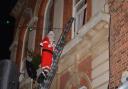 Father Christmas being rescued from the Town Hall 2013, photo: Charles Burnett, Romsey Local