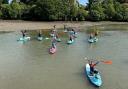 Volunteers on paddle boards helped clean-up Bartley Water at Eling Tide Mill as part of a Paddle UK campaign
