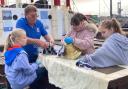 The girls chipped in with volunteer crew members to get the steamship ready for its weekend sail