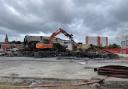 Images show the demolition of the site