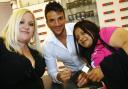 Peter Andre meets fans Stacey Sanunders, left, and Suzi Singh at the Perfume Shop, Marlands Mall, Southampton, where he launched his new men's fragrance 'Conditional'