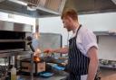 Lewis Huggins at work in the kitchen