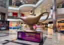 The sizable golden lamp will inhabit Level 2 at the shopping hub until August 18