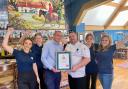 Staff at The Duke on the Test celebrating their latest award