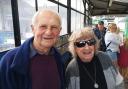 Margaret Blake is congratulated by her husband Roy after completing 90 lengths of Hythe Pier