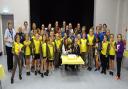 Past and present 2nd Calmore Brownies and leaders with Kay and Charlotte cutting the cake