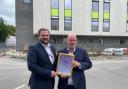 Mark Young, Deputy Director of Estates and Facilities, presenting the award to Richard Walker, Head of Facilities