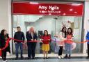 Cutting the ribbon to the new shop