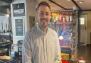 The Hunters Inn General Manager Ben Robbins standing in front of the bar.