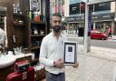 AK Grooming Room owner AK Serdar with his award for Hampshire's Best Barbers.