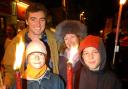 Alistair Scott, his partner Georgina and sons Thom and James await the start of the torchlit procession from Winchester Broadway to the fireworks display in North Walls recreation ground on Saturday T4068A photo Terry Bond