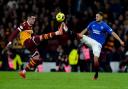 Motherwell's Lennon Miller (left) has been linked to Saints in Scotland