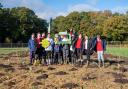 Children from Brockenhurst Church of England Primary School and William Gilpin Church of England Primary School at the New Forest Showground helping to plant the ‘mini-forest’