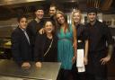 Housemates Carole (third left) and Kara-Louise (turquuoise dress) join owner Nikon Raftopoulos (left) and his kitchen staff at [one of] the opening night[s] of Ninety Degrees restaurant bar in Southampton. Photo: Andrew McCargow