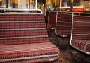 Seats on the museum’s iconic red AEC Regent III RT bus