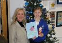 Caroline Dinenage MP and competition winner Emelia