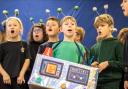 Year 2 pupils from Foxhills Infant School sing their hearts out in their fun-filled alternative nativity Christmas With The Aliens