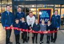 ParalympicsGB Athlete: Aaron Phipps. with Dan Jollie Store Manager and children from Calmore infants