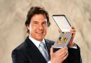 Actor Tom Cruise was presented with the US navy Distinguished Public Service Award (Ian West/PA)