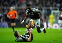 Newcastle United’s Fabian Schar (left) after being fouled by Aston Villa’s Jhon Duran (right) leading to a red card during the Premier League match at St. James’ Park, Newcastle upon Tyne. Picture date: Thursday December 26, 2024.