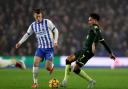 Solly March (left) and Kevin Schade battle for the ball (PA)