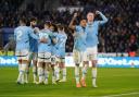 Savinho, left, and Erling Haaland scored as Manchester City won 2-0 at Leicester (Joe Giddens/PA)