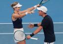 Katie Boulter and Charles Broom celebrate their crucial mixed doubles victory (Mark Baker/AP)