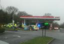 Four police cars were seen on blue lights entering a petrol station near Corfe Mullen on Christmas Eve.