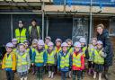 The pupils visited the site of eight affordable homes being built in Curdridge village