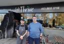 Staff members Max (left) and Lee (right) outside Café Thrive