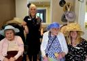 Staff and residents cheer on horses during joyful afternoon gathering