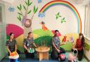 Hospital staff brighten children’s waiting room with hand-painted mural
