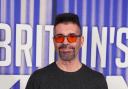 Simon Cowell wants to create a new boyband (Ian West/PA)