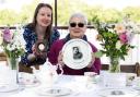 Commemorative plates feature names and rare WWII-era photographs