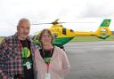 Jon and Nina Wallace visiting air ambulance HQ following Nina's cardiac arrest