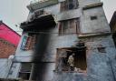 A resident inspects his house damaged by Pakistani artillery shelling, along the Line of Control, Indian-controlled Kashmir (Channi Anand/AP)