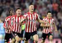 Dan Ballard and team-mates celebrate his winning goal (Steve Welsh/PA)