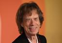 Sir Mick Jagger’s production company will make a film about Miles Davis (Doug Peters/PA)
